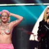 Avril Lavigne encara a una manifestante en ‘topless’